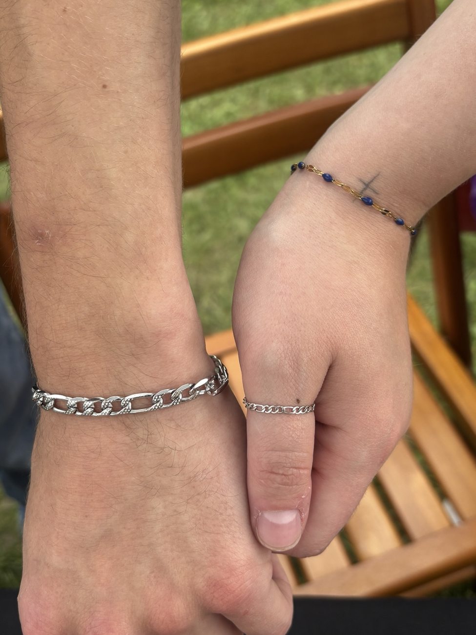 Matching gold bracelets with colored birthstone accents